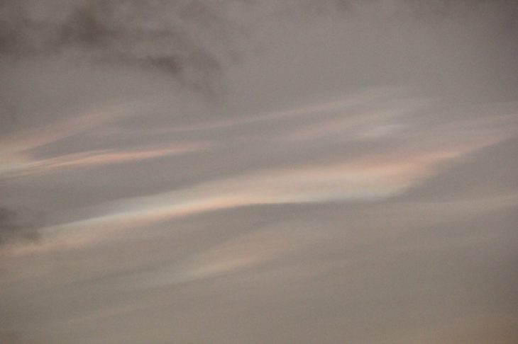 Faint nacreous clouds in the dawn light